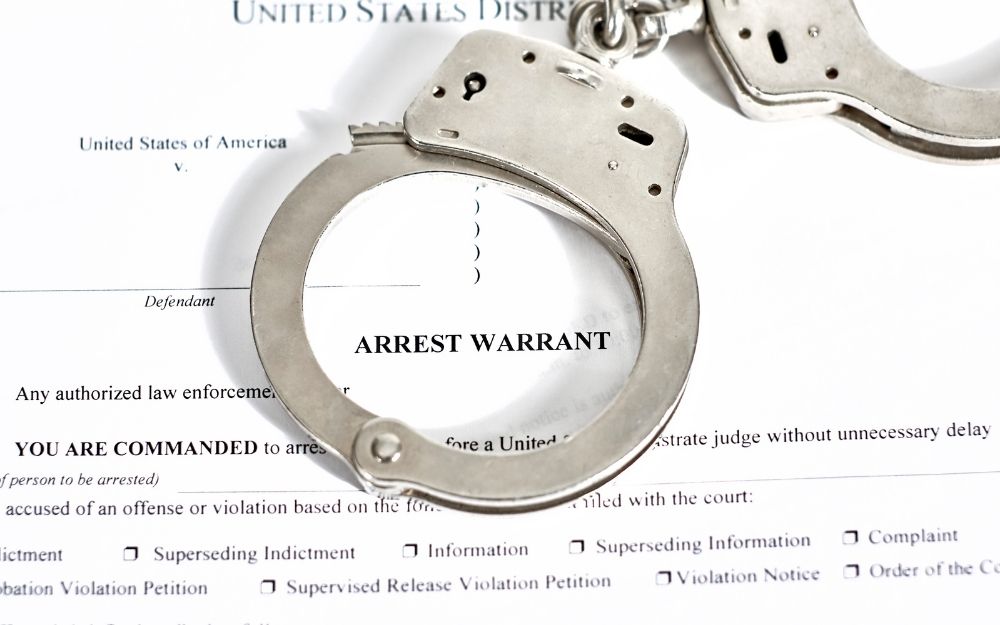 handcuffs on arrest warrant