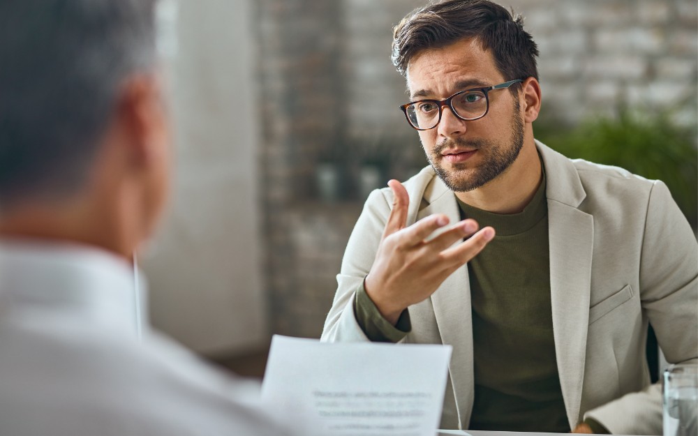 Man talking to his lawyer about a QP9