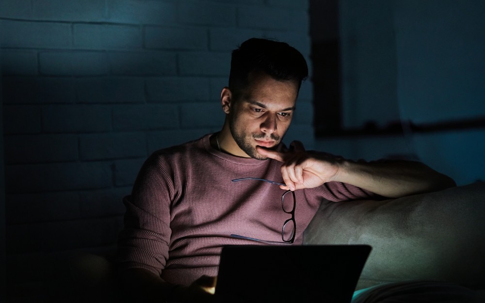 Man checking social media. But How Does Social Media Impact NSW Trials?