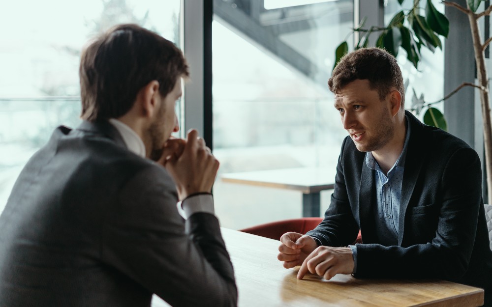 Man talking to a lawyer about the defence of mistake of fact in Queensland